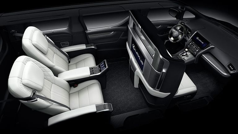 interior cabin view of the luxurious white reclining seats of a Lexus LM 300h