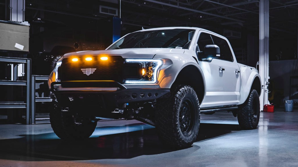 Mil-Spec Ford F-150 with headlights on 