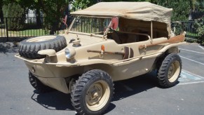 A tan 1944 Volkswagen Type 166 Schwimmwagen with its fabric roof up