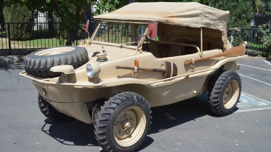 A tan 1944 Volkswagen Type 166 Schwimmwagen with its fabric roof up