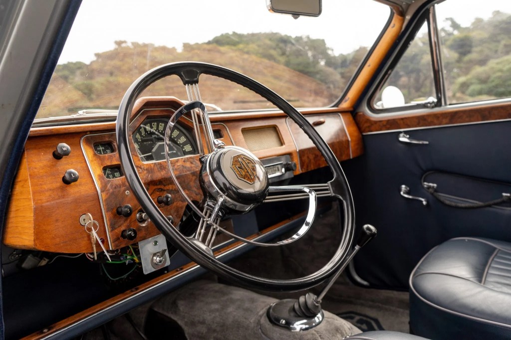 The real-wood dashboard and blue leather upholstery of a 1958 MG Magnette ZB Varitone