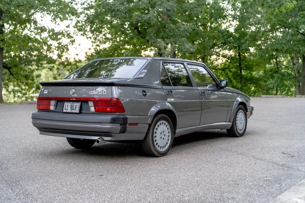 The rear view of a gray 1988 Alfa Romeo Milano Verde