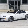 A white 1990 Nissan 300ZX Twin Turbo in front of an industrial building