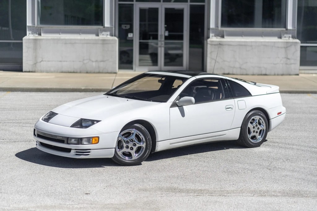 A white 1990 Nissan 300ZX Twin Turbo in front of an industrial building