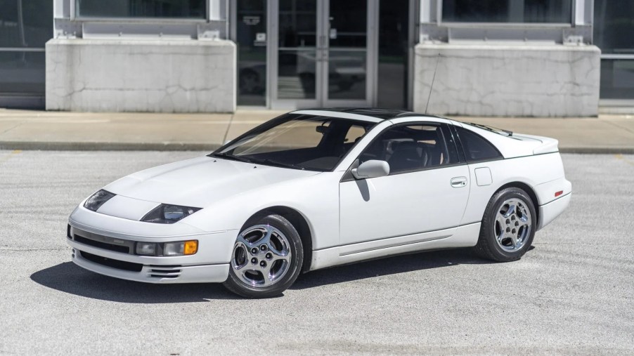 A white 1990 Nissan 300ZX Twin Turbo in front of an industrial building