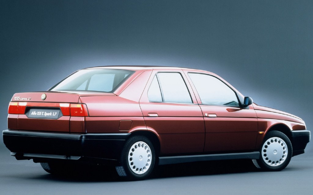 The rear 3/4 view of a red 1993 Alfa Romeo 155