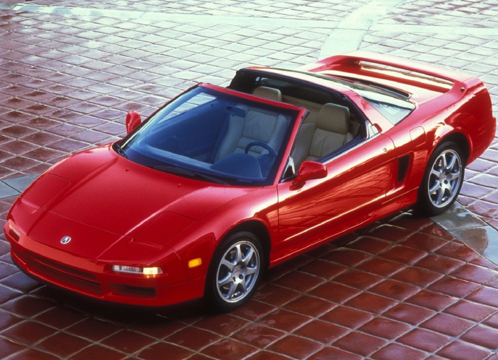 A red 1995 Acura NSX-T with its roof off