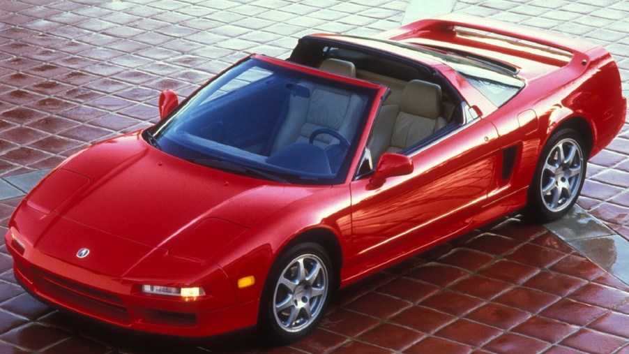 An image of a 1995 Acura NSX in a driveway.