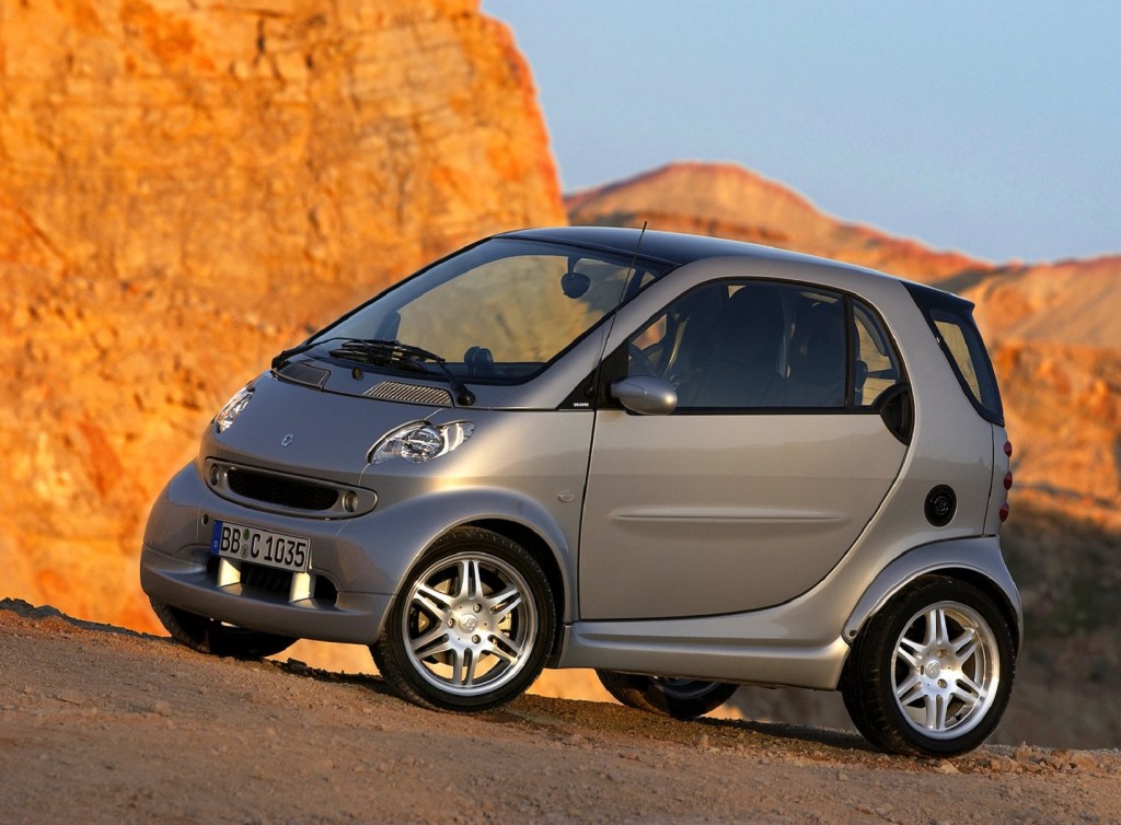 A silver 2005 Brabus Smart Fortwo in the desert