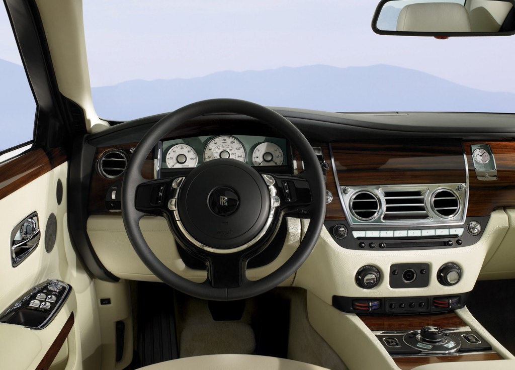 The 2010 Rolls-Royce Ghost's tan-leather and wood-trimmed interior