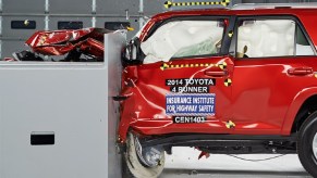 A red 2014 Toyota 4Runner SUV getting crash tested for safety