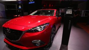 A 2015 Mazda3 on display at an auto show