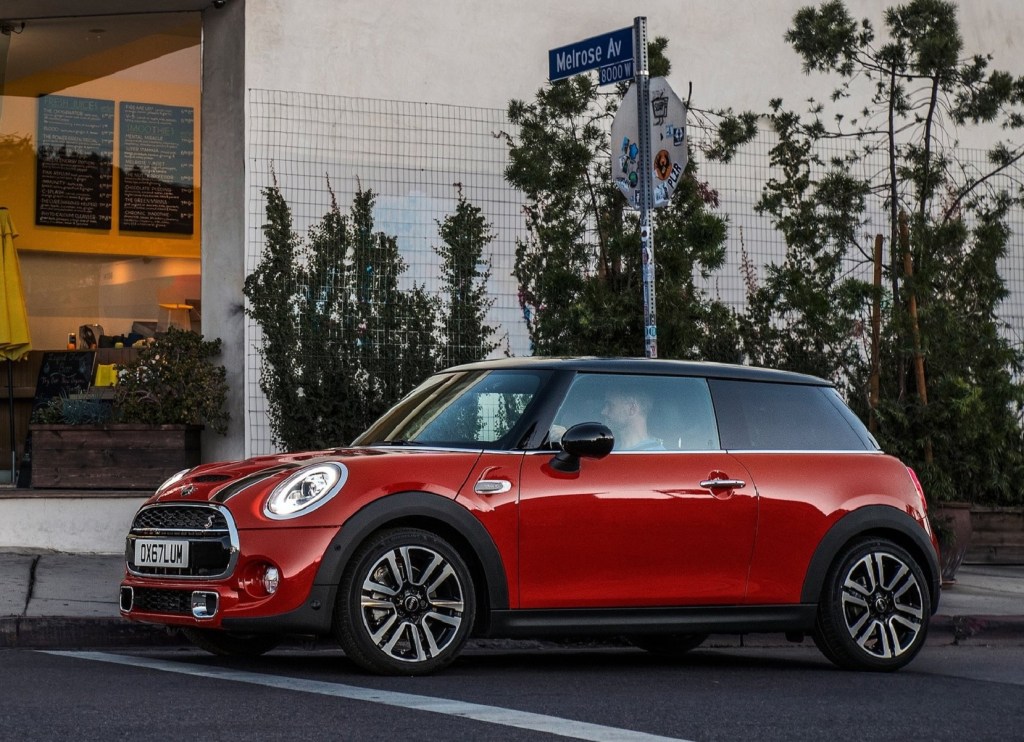 A red 2019 Mini Cooper S waits at an intersection