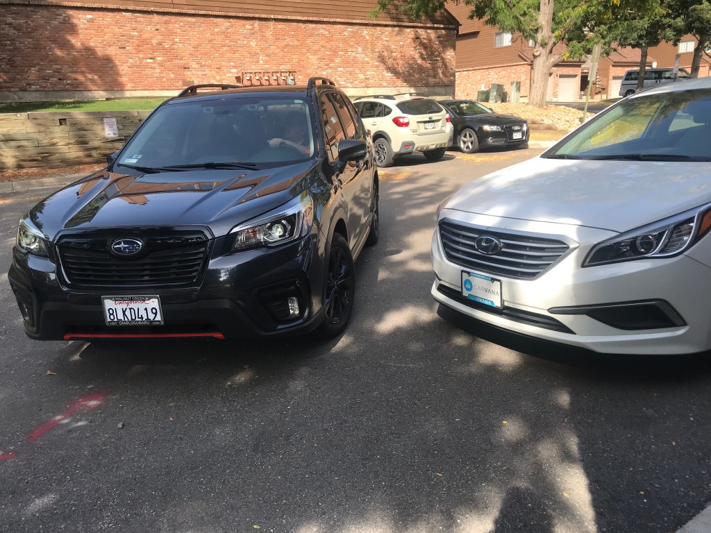 2019 Subaru Forester next to the Carvana car