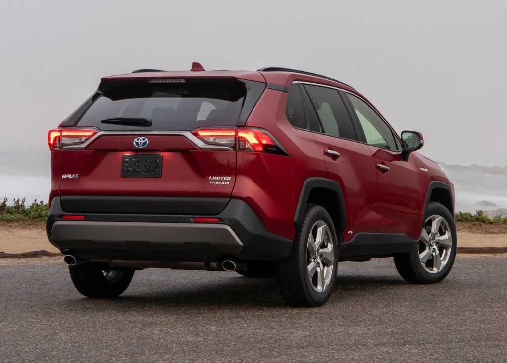 The rear of a red 2019 Toyota RAV4 Hybrid Limited on a foggy day