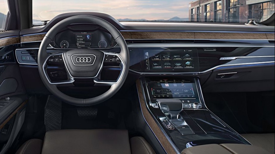 The leather-and-wood-trimmed center console of the 2020 Audi A8