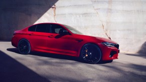 2020 BMW M5 in red parked in the shadows
