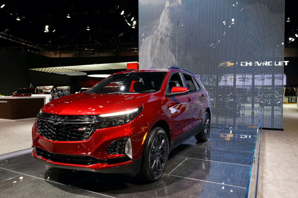 A Red 2020 Chevy Equinox on display at an auto show