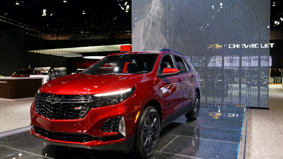 A Red 2020 Chevy Equinox on display at an auto show