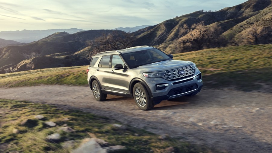 A 2020 Ford Explorer driving up a gravel road