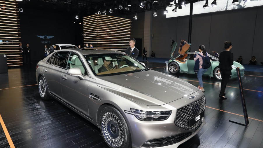 A silver 2020 G90 on display at an auto show