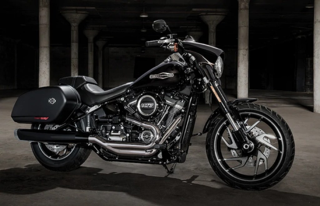A black 2020 Harley-Davidson Sport Glide in a garage