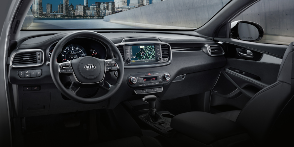 Front seats of the 2020 Kia Sorento crossover with black cloth upholstery.