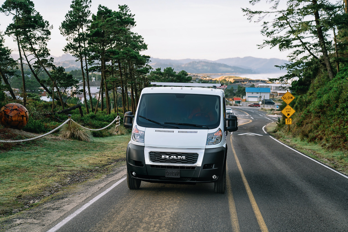 2020 Ram ProMaster on the highway with trees