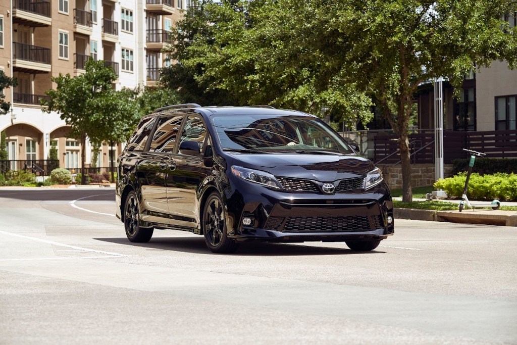 2020 Toyota Sienna driving around apartment buildings