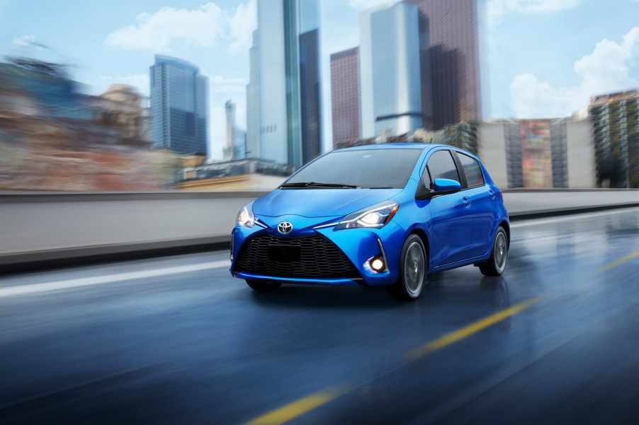 A blue 2020 Yaris driving on the track