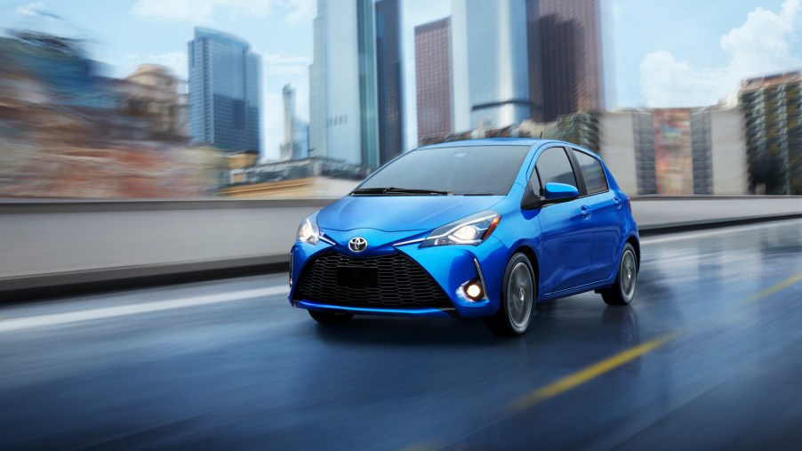 A blue 2020 Yaris driving on the track