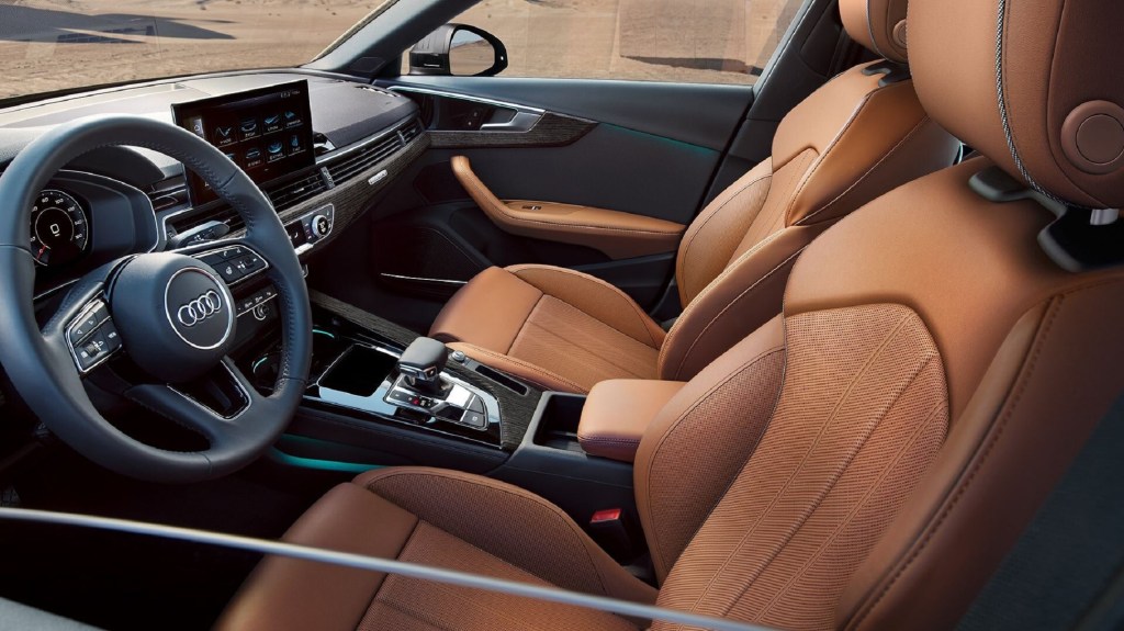 The 2021 Audi A4's brown-leather front seats and black dashboard