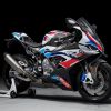 A white-red-and-blue 2021 BMW M 1000 RR on a rear-wheel stand