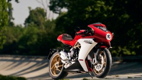 A red-and-white 2021 MV Agusta Superveloce 800 on a tree-lined racetrack