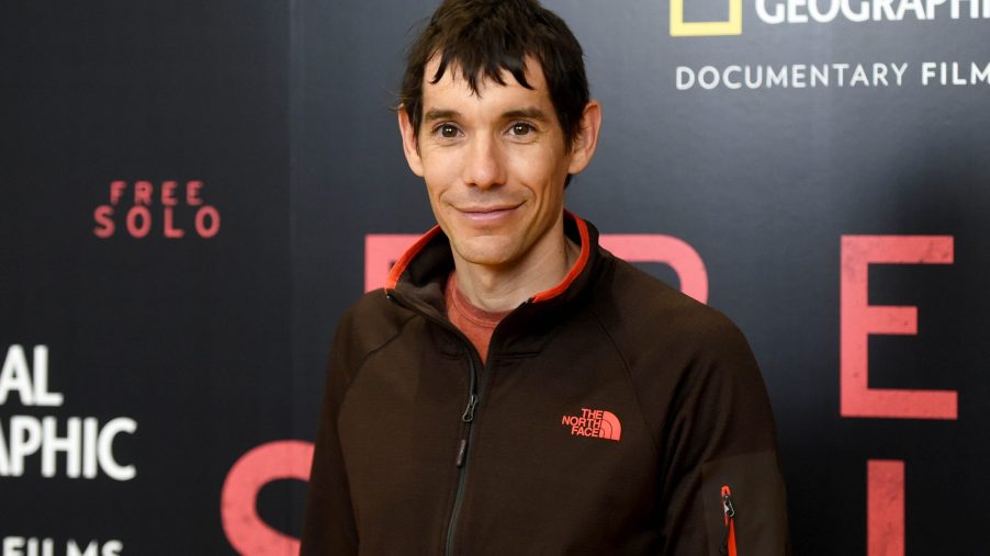 Alex Honnold posing for a photo at the premiere of a documentary