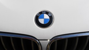 Close-up of the BMW logo on the hood of a car