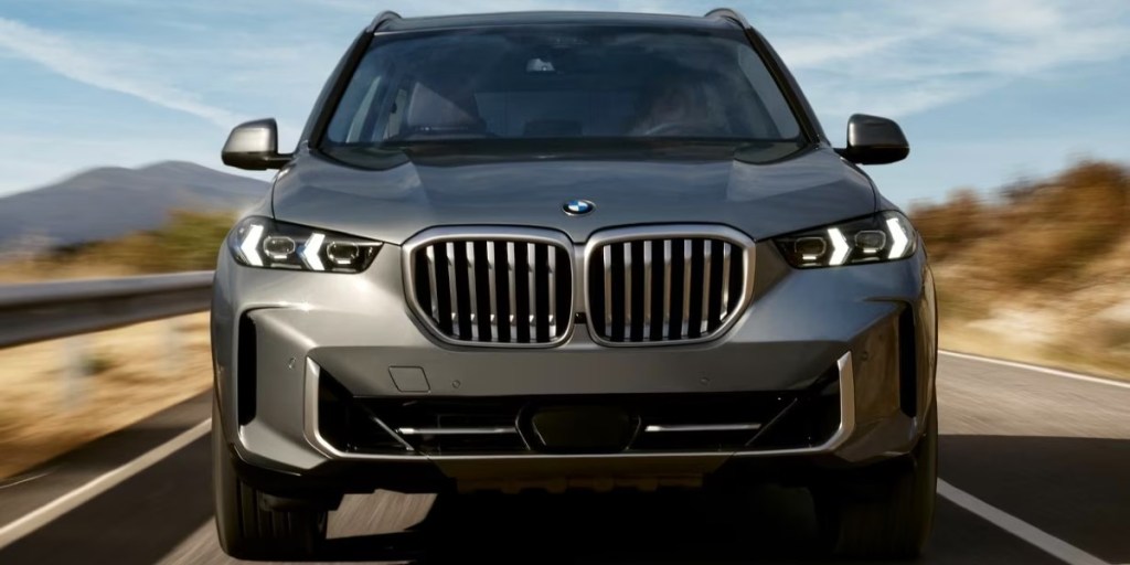 The front of a gray BMW X5 midsize SUV.
