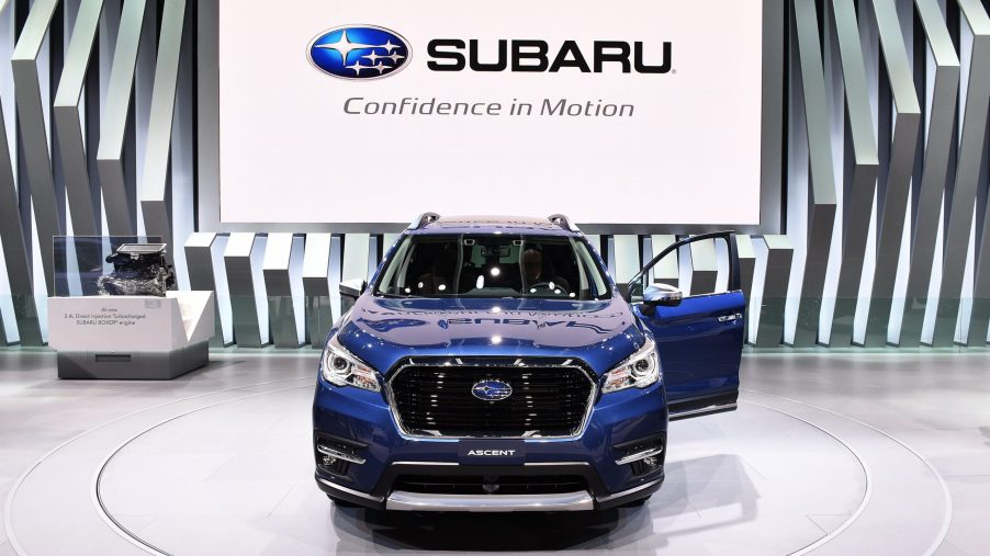 A blue Subaru Ascent on display at an auto show