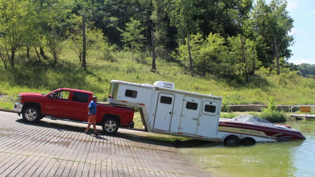 The boat and camper RV trailer at the boat launch.