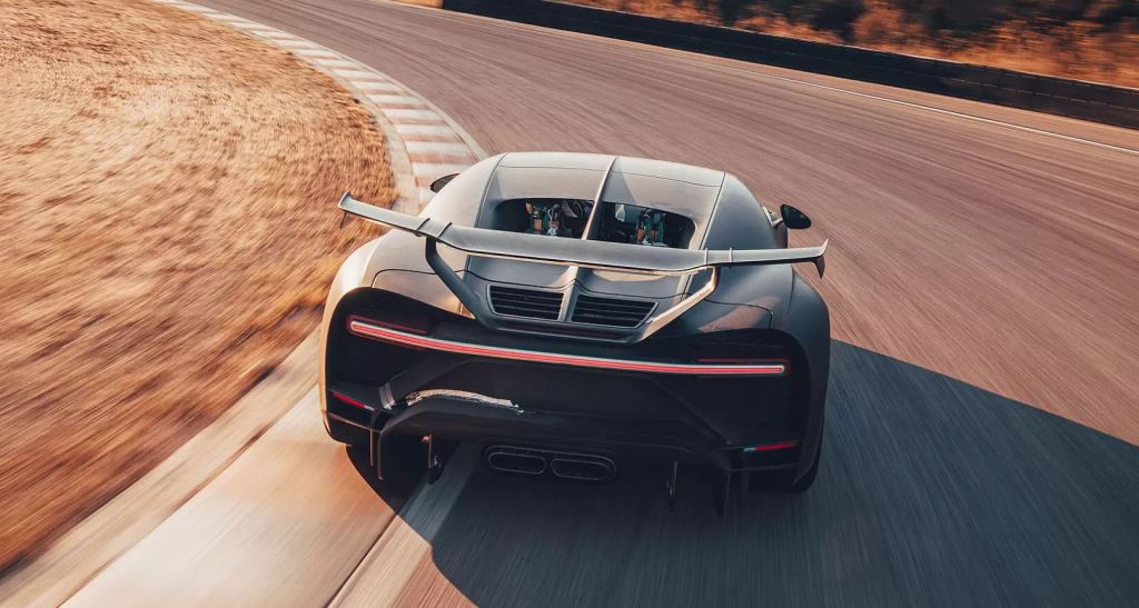 The Bugatti Chiron Pur Sport rounds a turn at a racetrack.