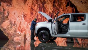 A man looks at a Chevrolet Silverado truck at the auto trade show, AutoMobility LA