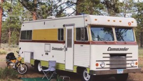 the Mander, Jessy's vintage RV set up in the woods for some time spent in nature
