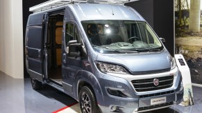 A Fiat Ducato panel van on display at an auto show