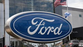 A Ford logo seen on a sign outside of a dealership