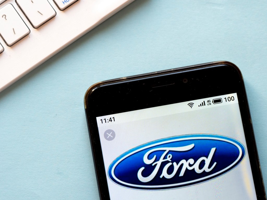 In this photo illustration a Ford logo seen displayed on a smartphone.