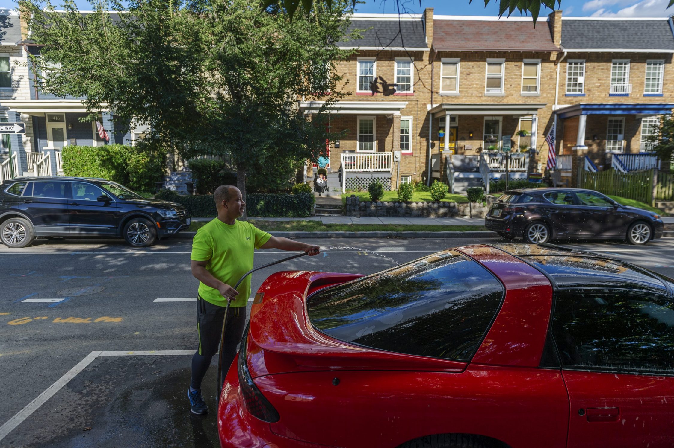 John Branscomb washes his car in the Barney Circle neighborhood in Washington, DC, on August 30, 2020.