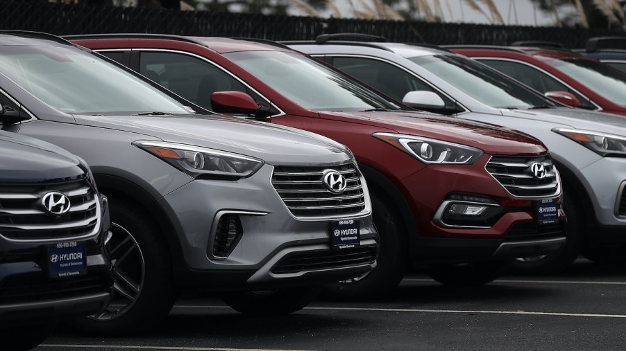 Row of Hyundai Santa Fe models outside a dealership