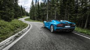 Lamborghini Aventador driving through the forest