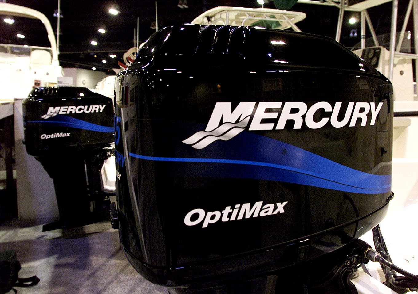 Mercury outboard motors on display at a boat show