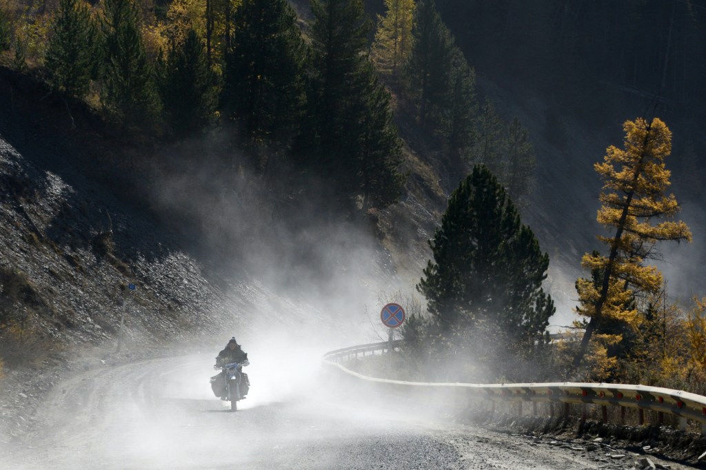 A man rides a motorcycle in the Ulagan District.